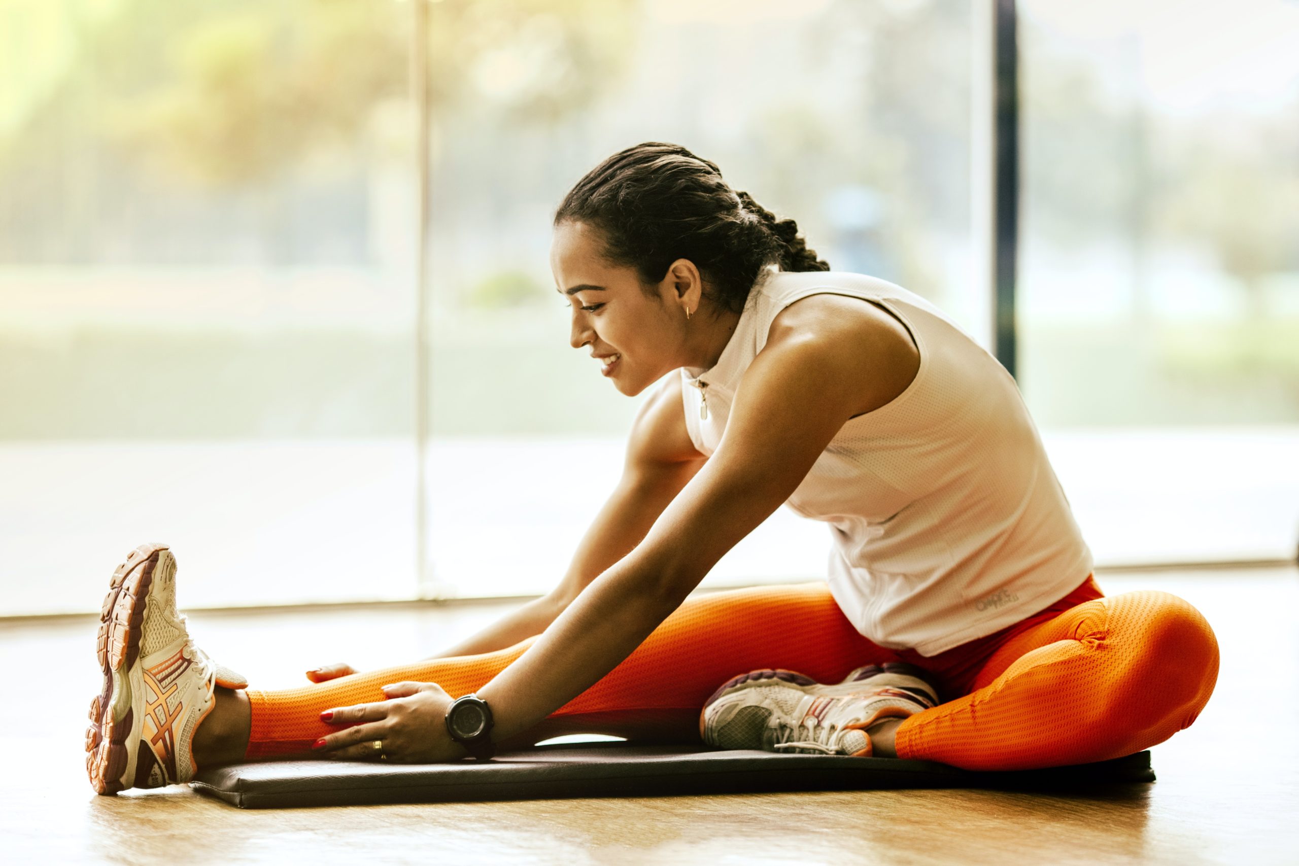 Woman on yoga mat performing exercise